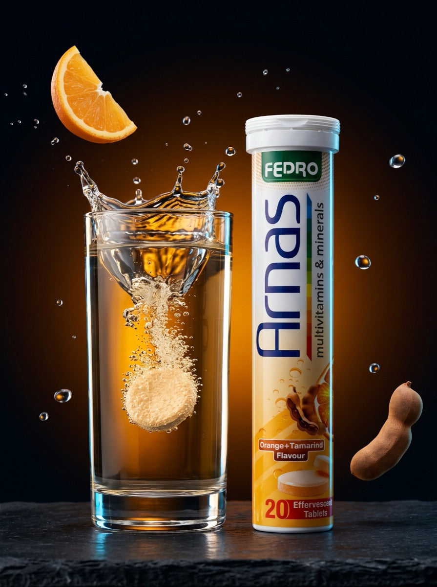 ARNAS tablet dissolving in a glass beside the tube